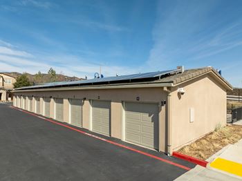 A long row of garage doors are closed.